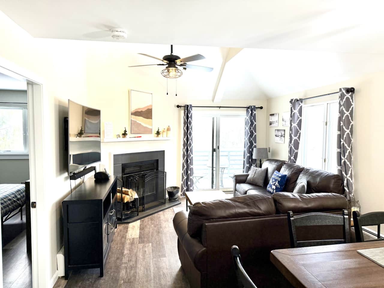 nice bright living room with large 65 inch UHDTV and sound bar