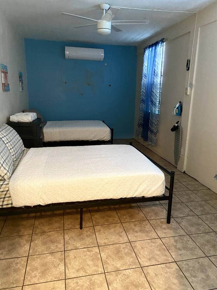 1 bedroom with two full beds for up to 4 people. Bedroom is equipped with an 18,000 Inverter Air Conditioned.
