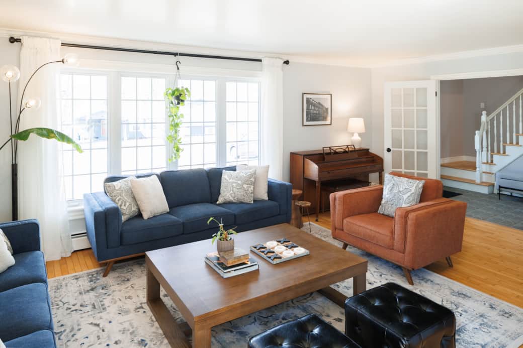 Light-filled living room with cozy seating and modern coastal style.