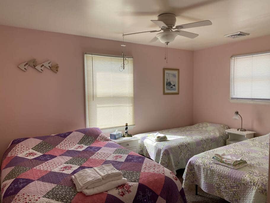 The Lighthouse room is on the 2nd floor, has 1 queen, 2 twins, TV and blackout curtains.
