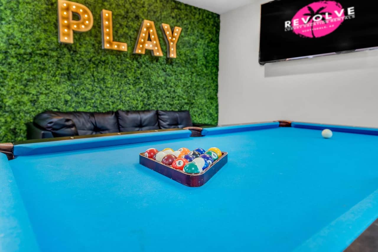 Game room inside the spacious guest house where you can cool off, play some pool or get ready at the beauty bar! 