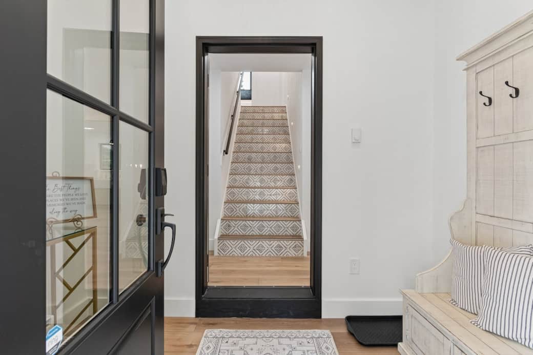 Welcome! Entry setting, local wall map, baseboard heater, seating, boot tray, and Welcome Bag await you.