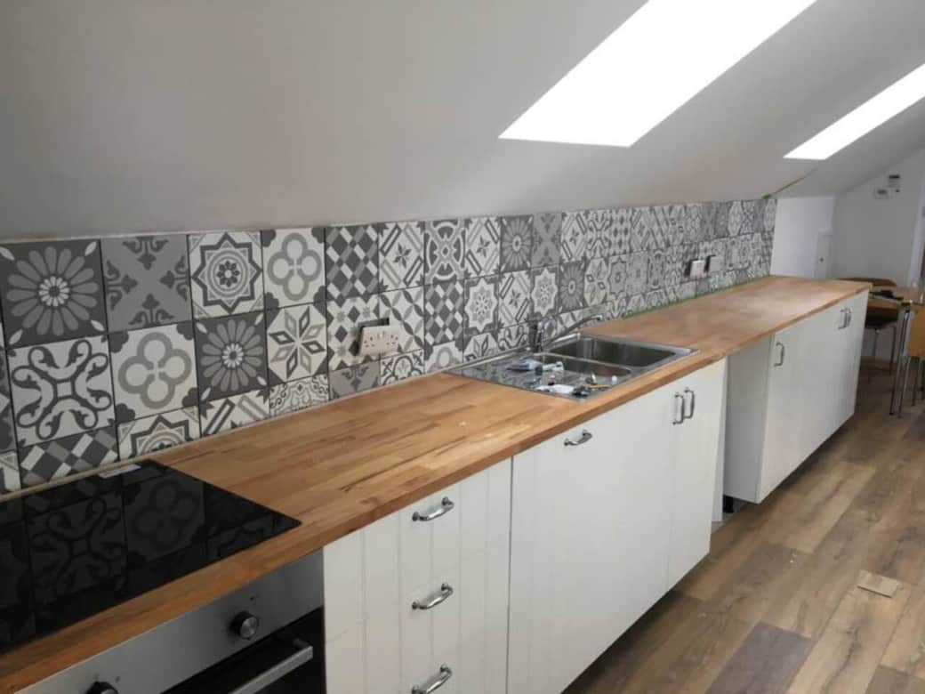 Galley style kitchen arrangement provides plenty of room for cooking up up a feast, or just warming up a quick snack. Features microwave, oven, four ring induction hob, grill, fridge with freezer compartment, toaster, kettle, sink and dishwasher. Galley style kitchen arrangement provides plenty of room for cooking up up a feast, or just warming up a quick snack. Features microwave, oven, four ring induction hob, grill, fridge with freezer compartment, toaster, kettle, sink and dishwasher.