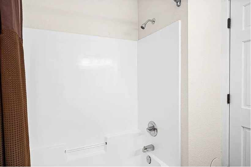 Full bathroom with towels and toiletries Full bathroom with towels and toiletries