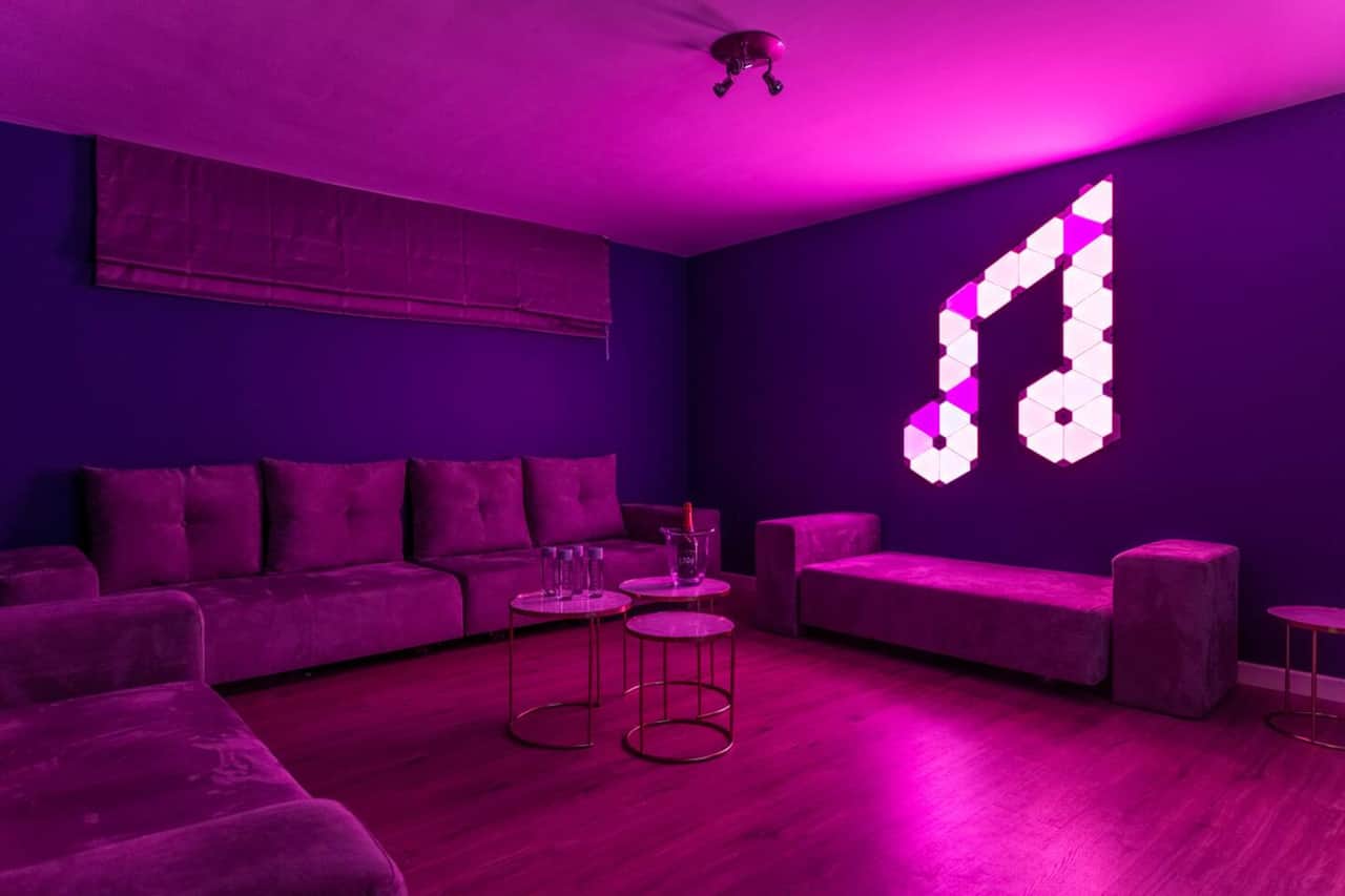 Disco with adjacent bar, 75" Smart TV with Spotify, Youtube... and music synched LED wall light system.
