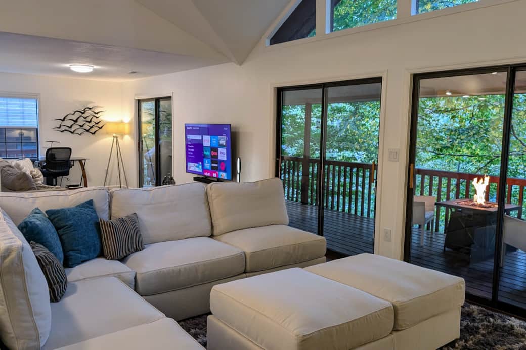 Back upstairs, there is easy access to the balcony, which overlooks the backyard and lake.