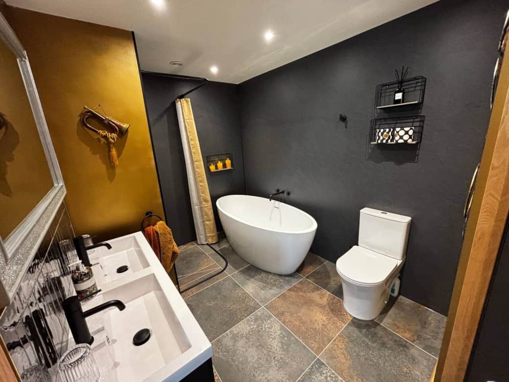 Luxury bathroom - twin sinks - shower - bath- quality bath sheet - bathrobes. 