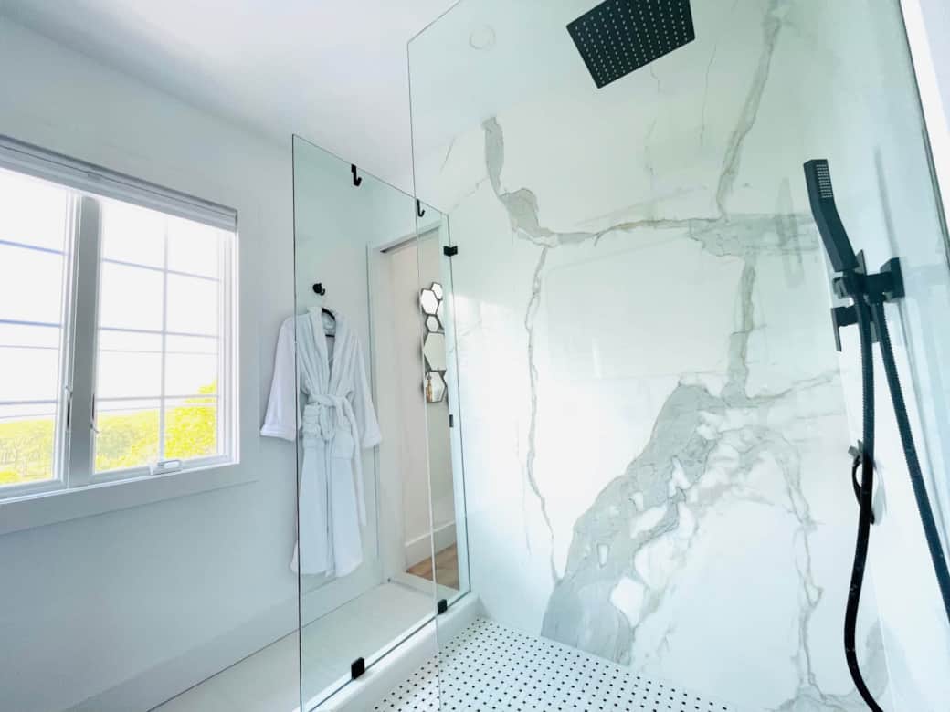 The Black and White bath’s oversized glass encased shower and views