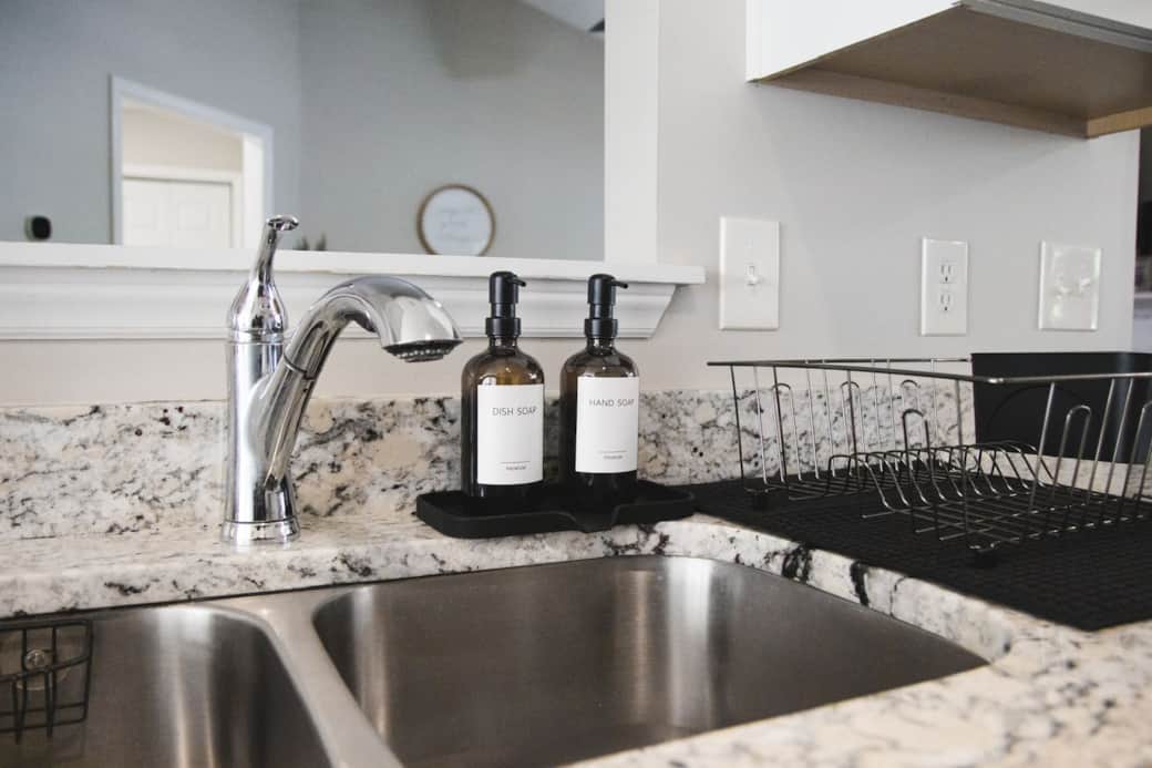 Hand and dish soap are provided. Under the sink you will find some dishwasher pods, a few trash bags, a first aid kit and a fire extinguisher!