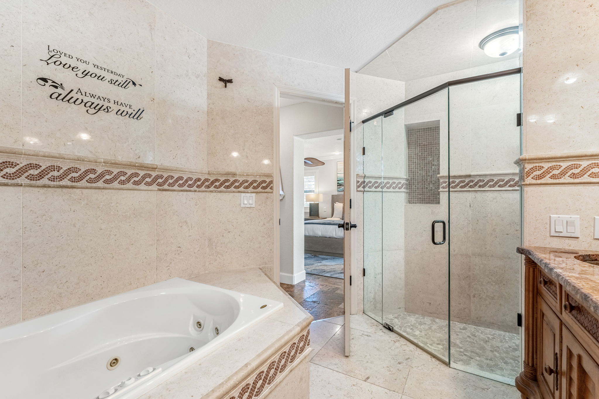 Rejuvenate in this luxurious bathroom with a soaking tub and spacious shower for ultimate relaxation