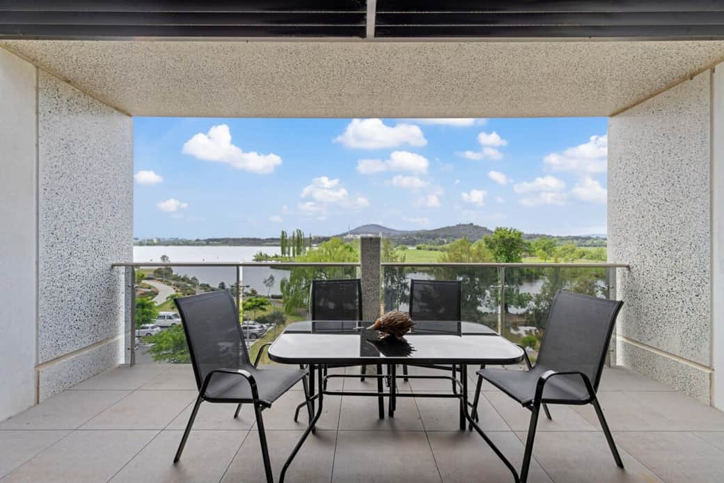Enjoy al fresco dining on your private balcony, complete with a modern table and chairs. The perfect spot to enjoy a meal while taking in the serene lake views. Start your day with a cup of coffee here, or end it when you watch the sunset. Enjoy al fresco dining on your private balcony, complete with a modern table and chairs. The perfect spot to enjoy a meal while taking in the serene lake views. Start your day with a cup of coffee here, or end it when you watch the sunset.