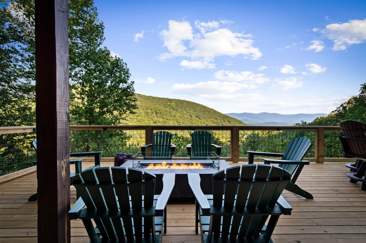 New extended lower deck! Large propane firepit with the amazing mountain views!