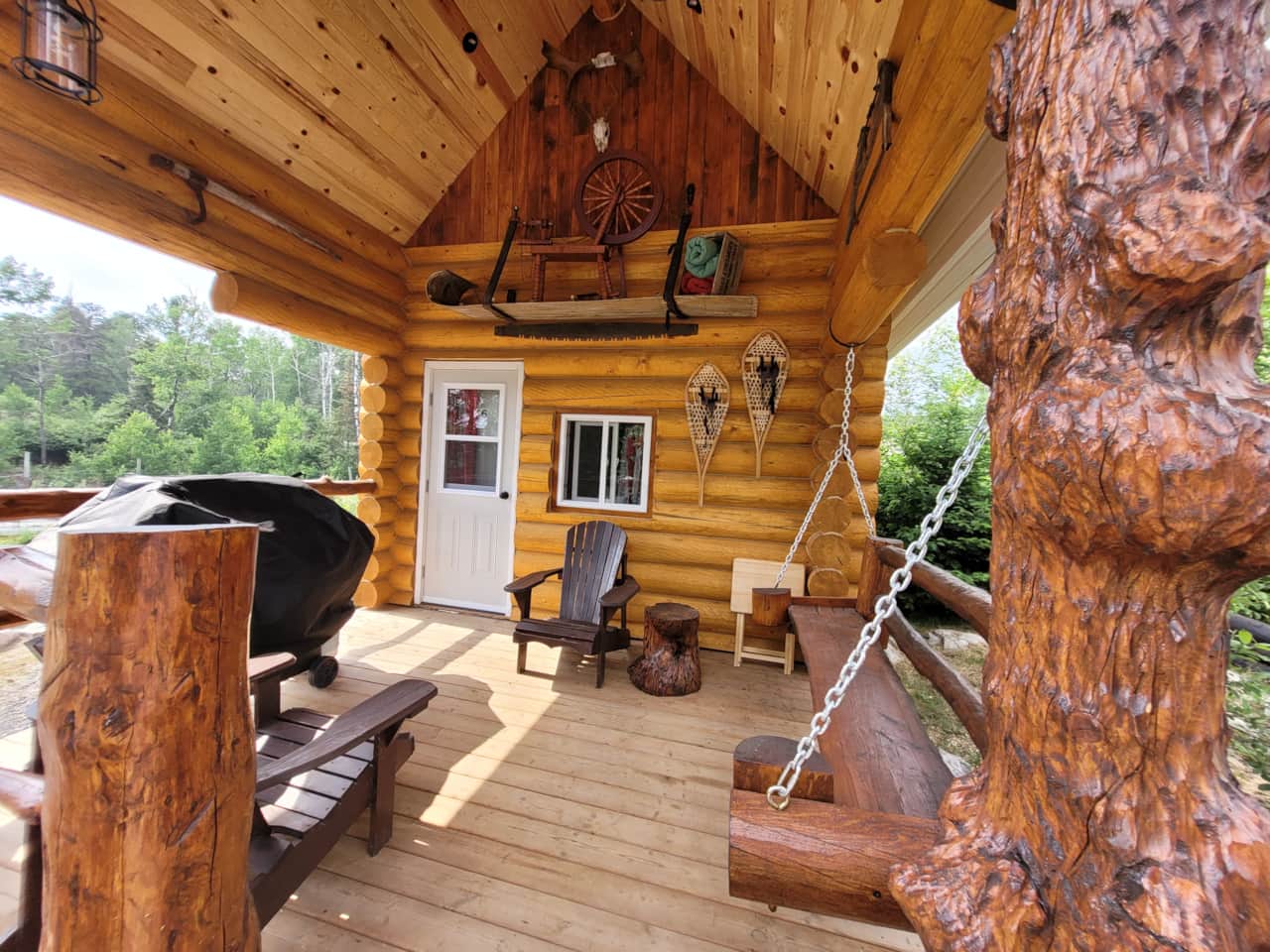 Site 16 covered deck with BBQ and log swing