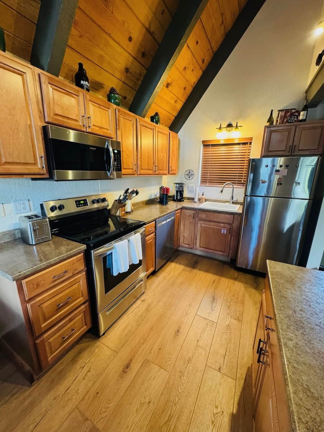 Well stocked kitchen. Window over looks the hot tub area