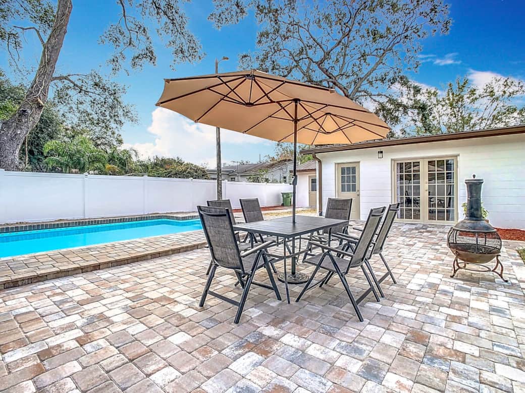 Shaded outdoor dining table. Chairs recline and become additional loungers