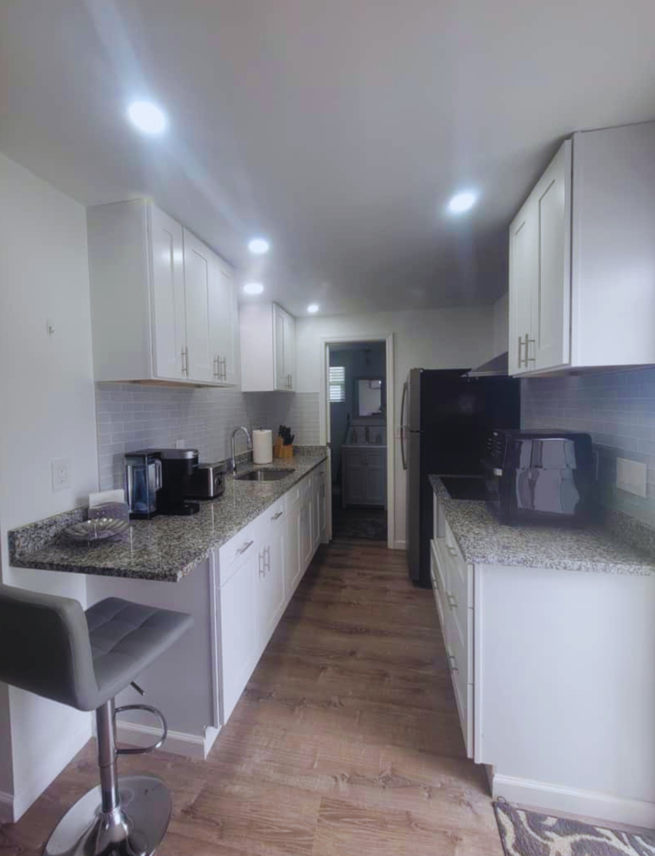 Bright fully equipped kitchen with cabinets and essentials. Lakeland, FL