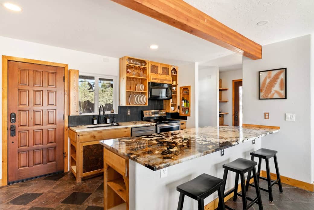 Primary kitchen with granite countertops.