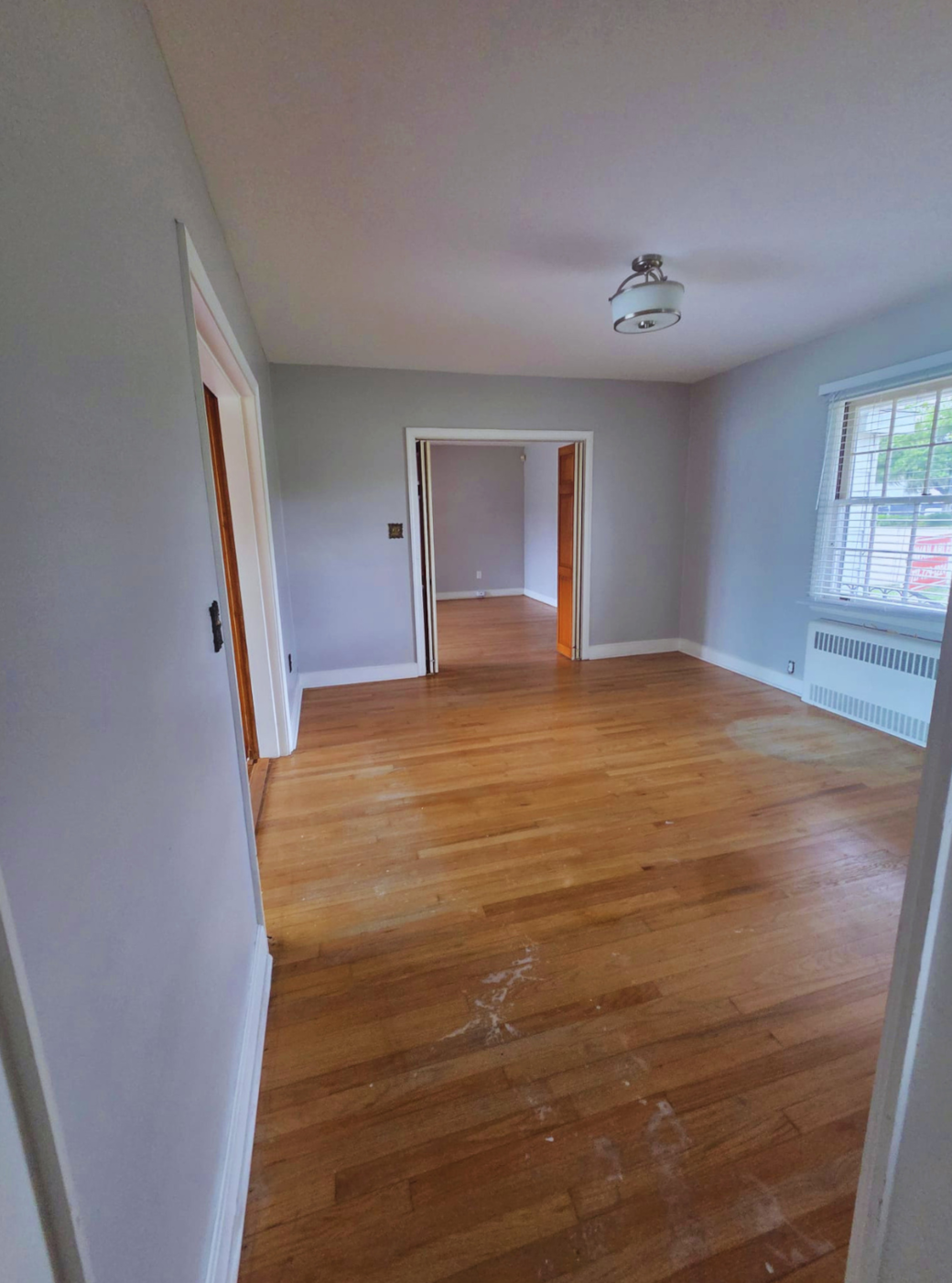 Spacious bedroom with large window and warm hardwood flooring. Mulberry, FL Spacious bedroom with large window and warm hardwood flooring. Mulberry, FL