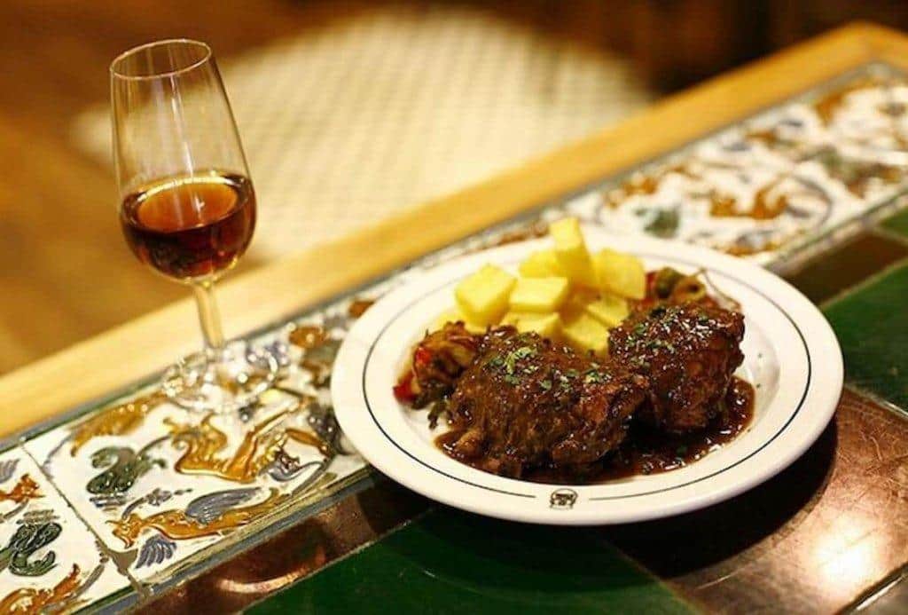 Varied tapas and a glass of Sherry wine in an Andalusian restaurant.