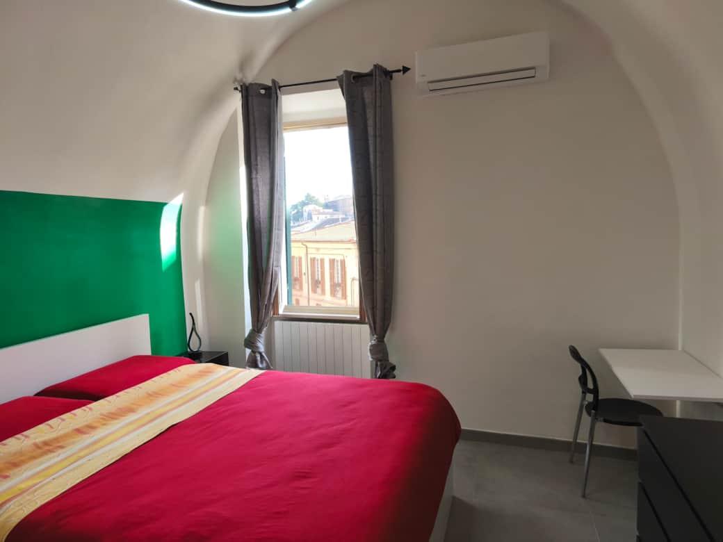 Main bedroom with AC at Agli Archi Eco House in Chieti