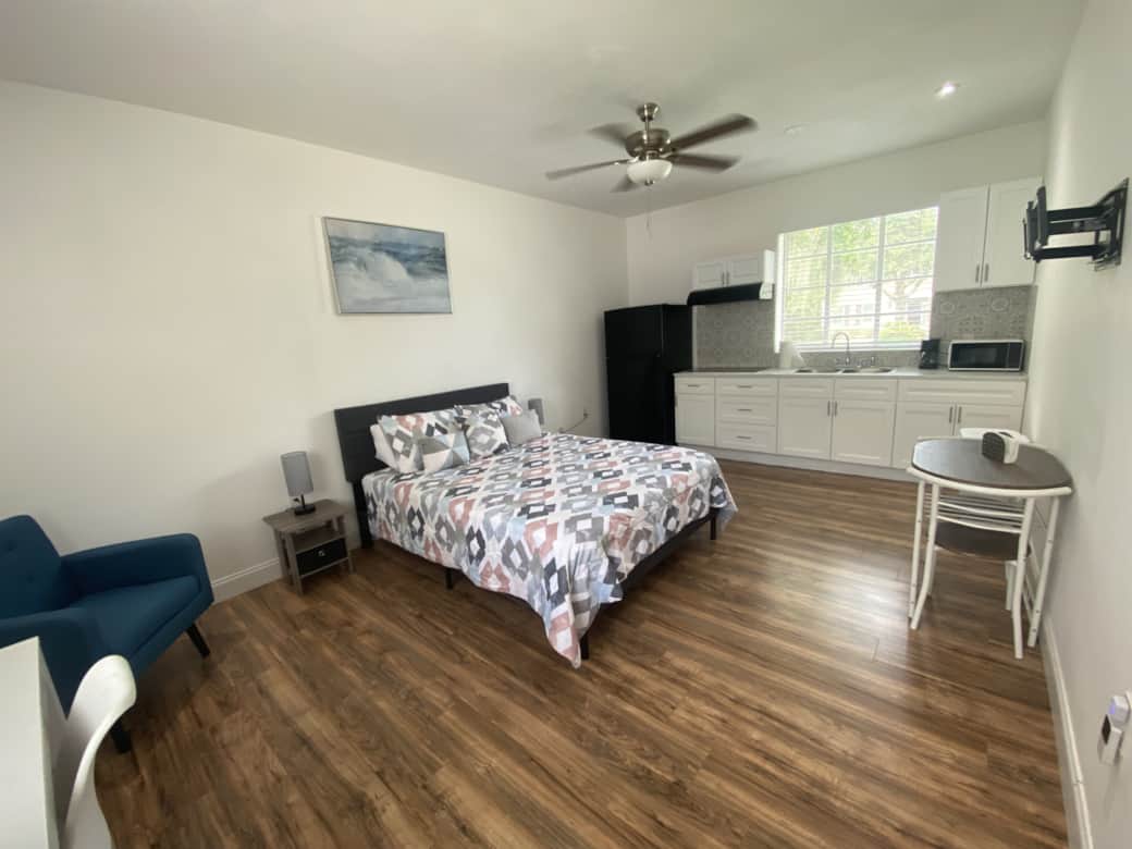 WRoom with nightstand, lamp, art decor, intimate dining space for two, and ceiling fan. Lakeland, FL WRoom with nightstand, lamp, art decor, intimate dining space for two, and ceiling fan. Lakeland, FL