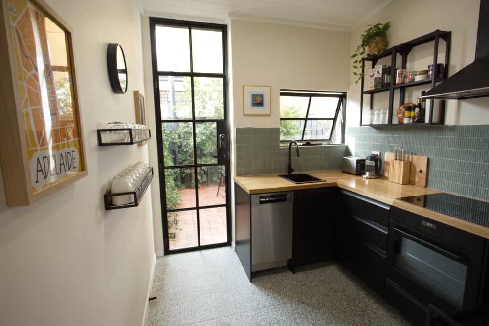 Fully equipped kitchen flowing out to the courtyard