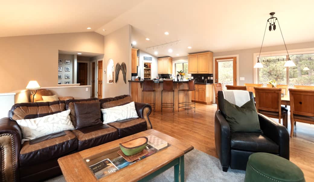 An open kitchen, dining room and living room