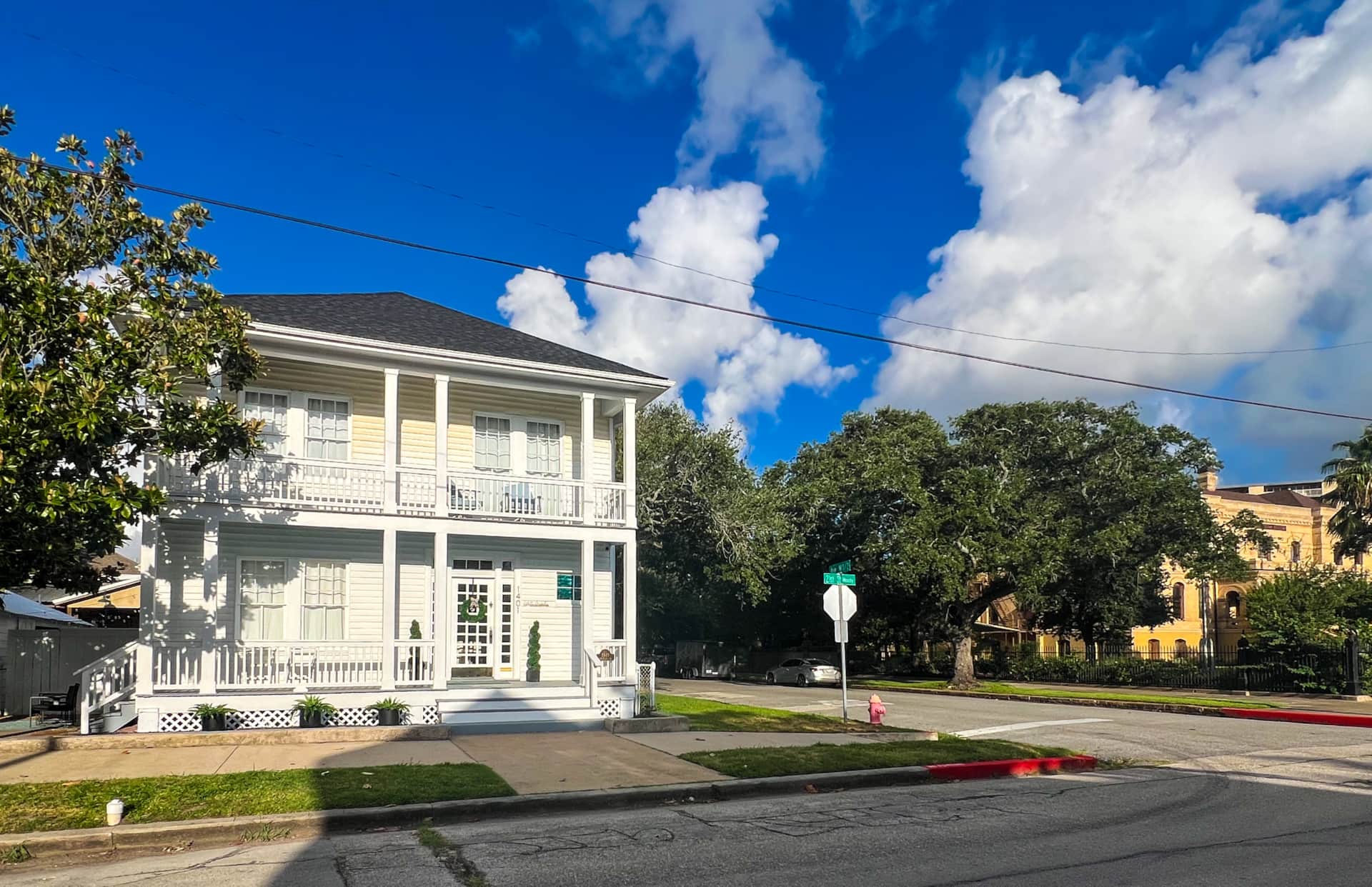 White Magnolia Galveston located next door to The Bryan Museum in Galveston’s East End Historic District