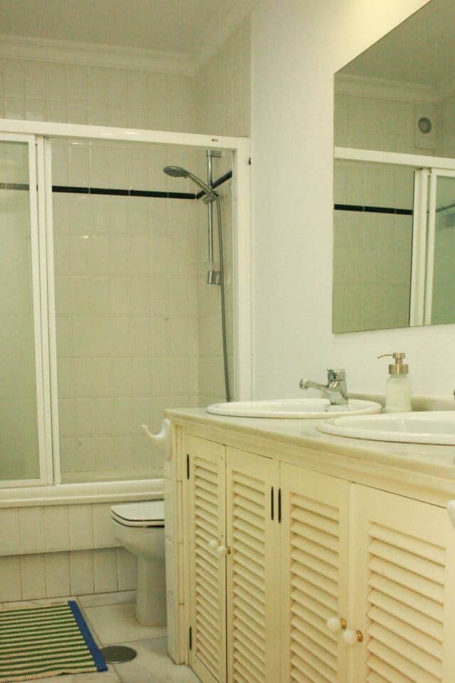 Shared bathroom for Rooms 2 & 3. Each bathroom comes equipped with shampoo,  body wash, soap, lotion, and a blow dryer. 