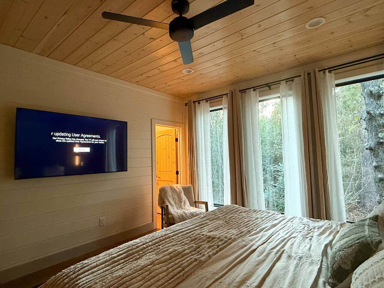 Large 65" TV for you to enjoy while you relax in bed.