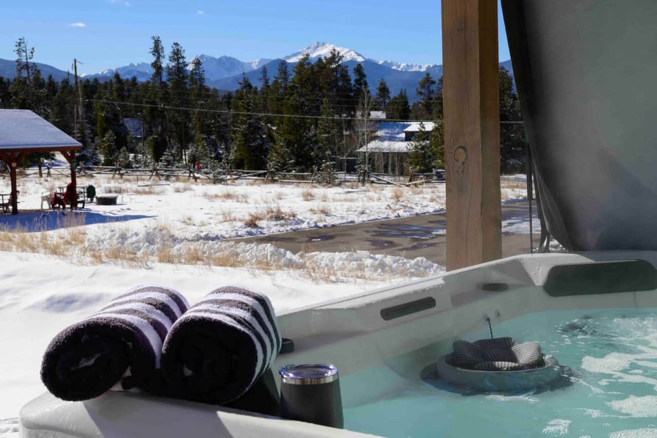 Enjoy the breath-taking views of the Rocky Mountains + Byers Peak while soaking your muscles! Hot tub towels and stainless steal drinkware is provided.
