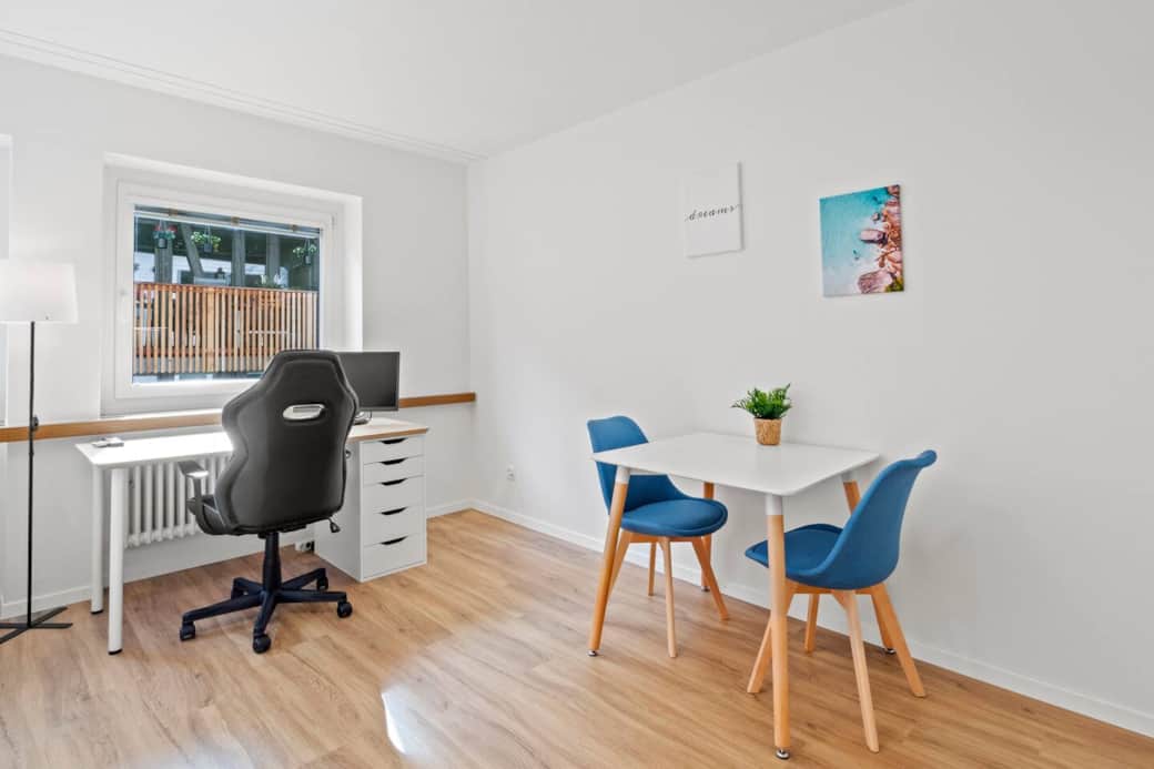 Work area with large desk and dining table – ideal for working and eating.