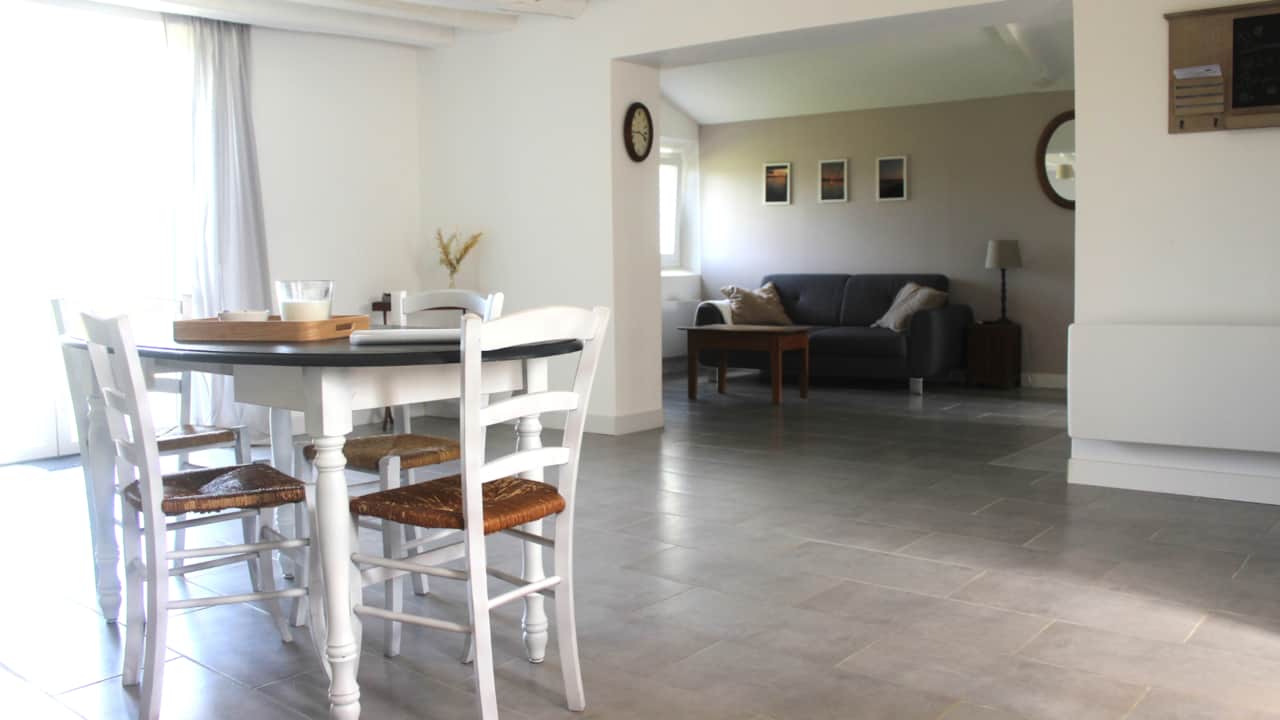 A beautiful living space with the living room and the dining room