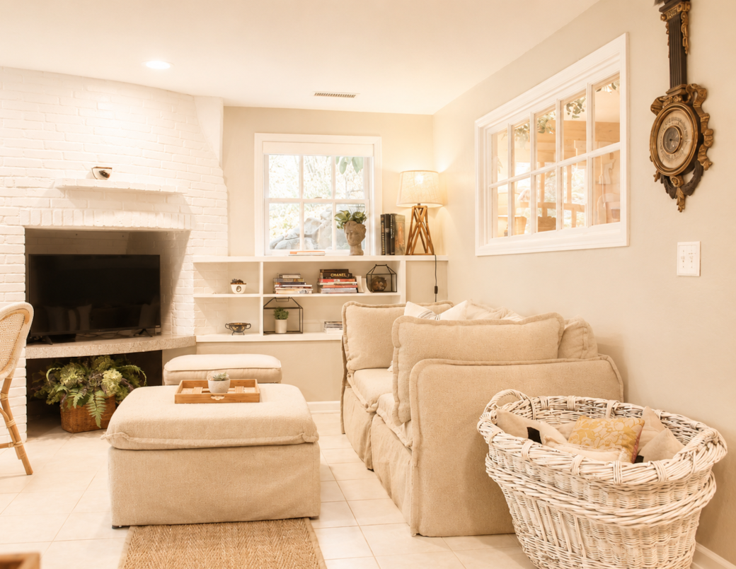 Comfortable couch seating with extra pillows and a Smart TV