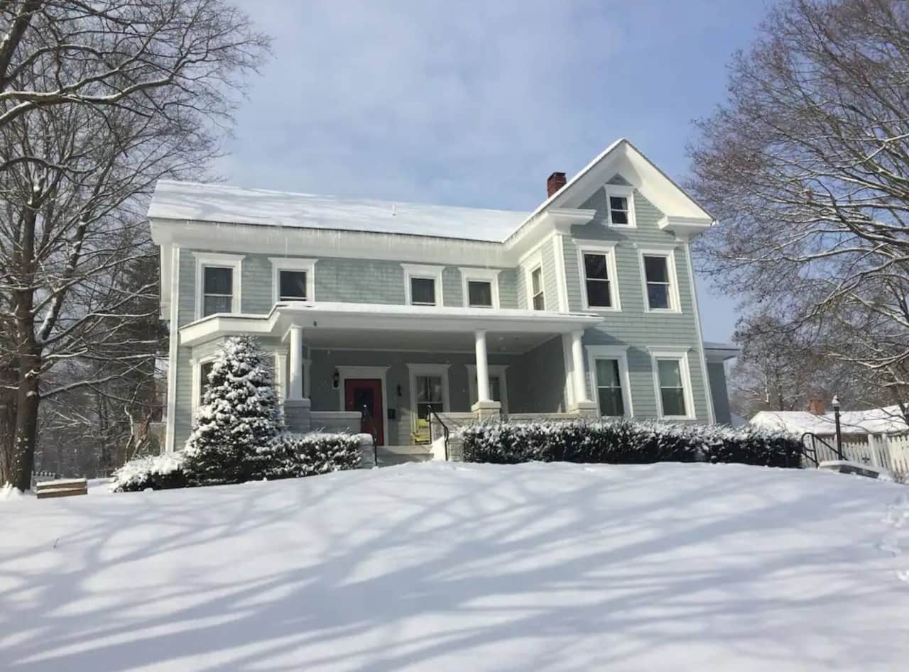 5-Bed Berkshire Vacation Home exterior in the snow, great for winter getaways.