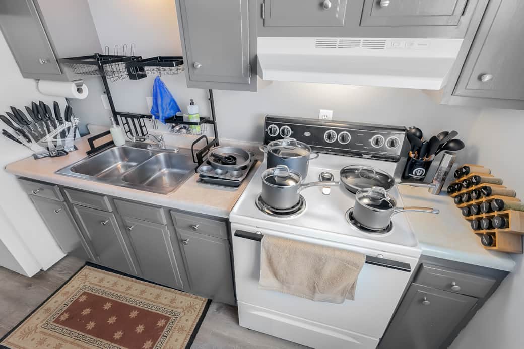 The kitchen is stocked with quality cookware, a spice rack, and nice knife set!