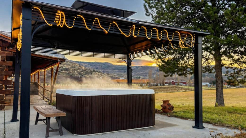 Soak in the hot tub with valley and mountain views under the gazebo.