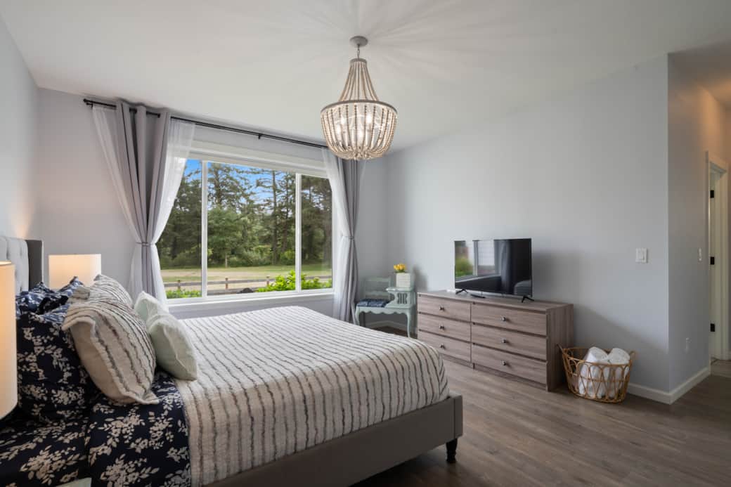 Wake up to tranquil garden views and nature’s calm right outside your oversized windows.
