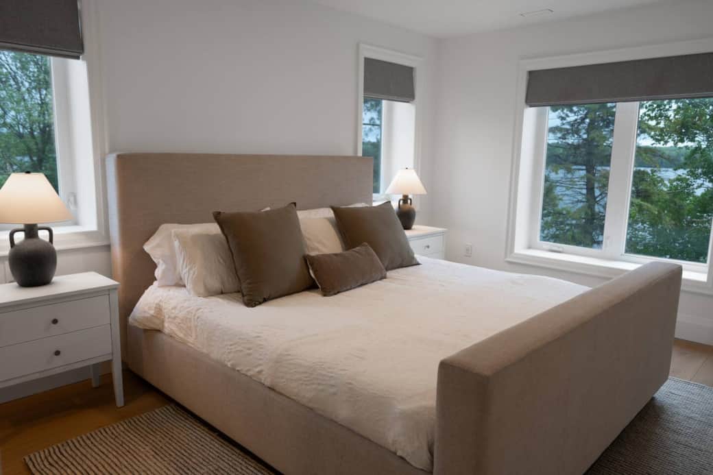 King sized bed with room-darkening shades featuring a closet.