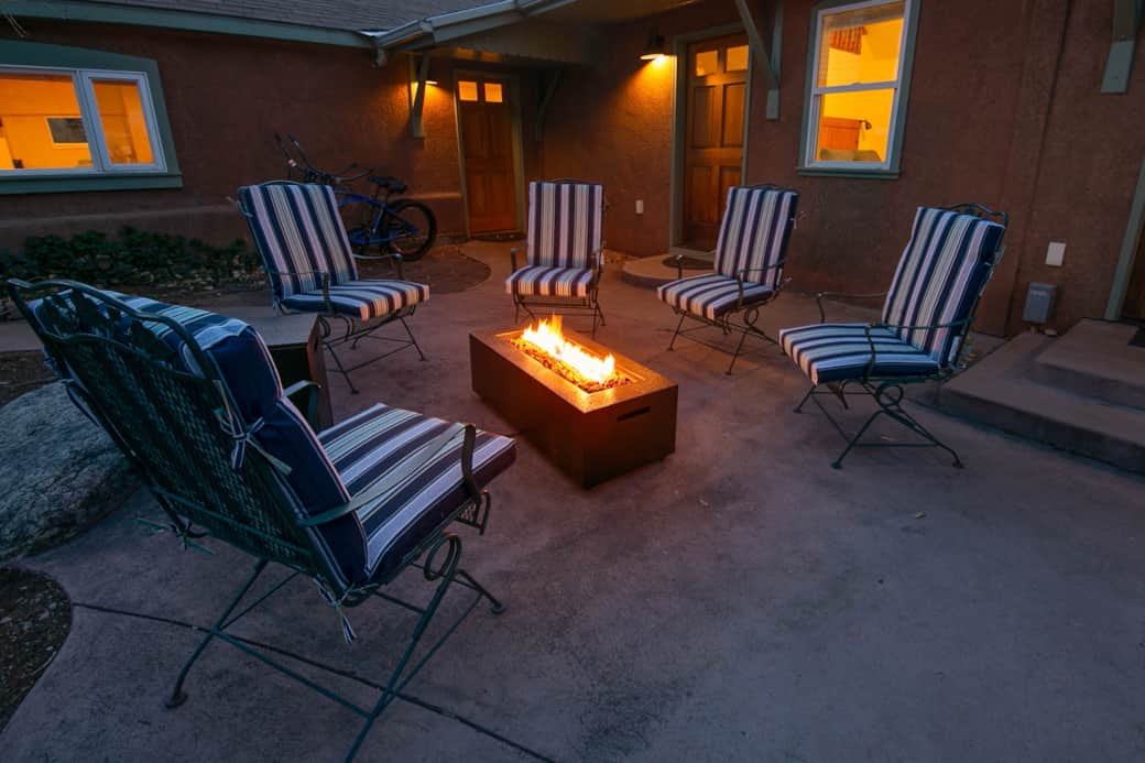 Peaceful gas fire pit in the enclosed courtyard. 