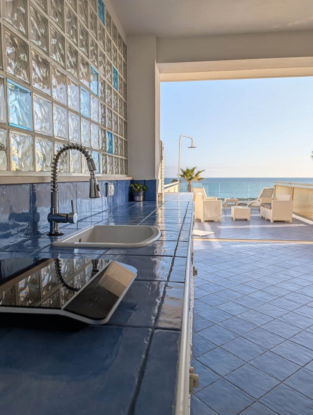 Outdoor kitchen sink with sea-view terrace