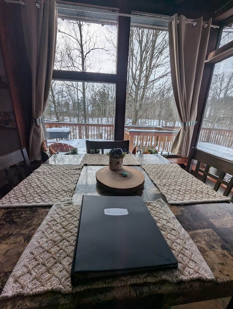 Kitchen table overlooking the deck and forest