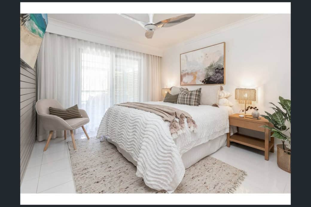 Master bedroom with queen bed on upper level and ensuite