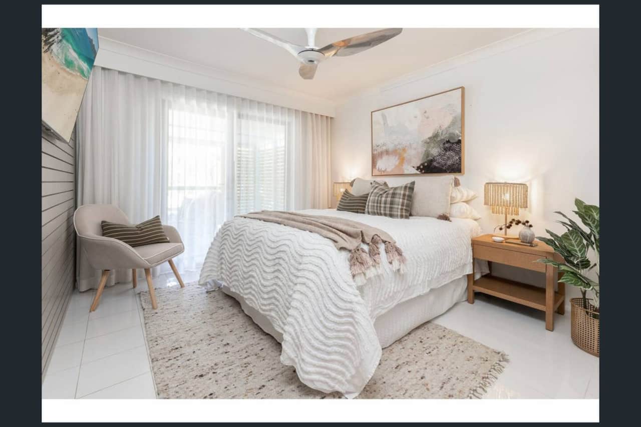 Master bedroom with queen bed on upper level and ensuite