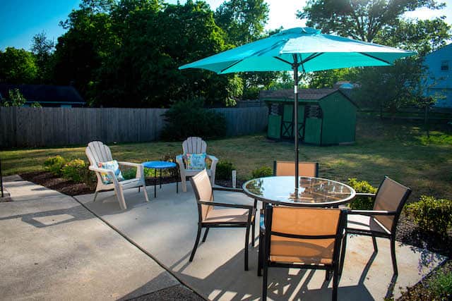 Gather, eat, and relax on the back porch - your outdoor retreat awaits.