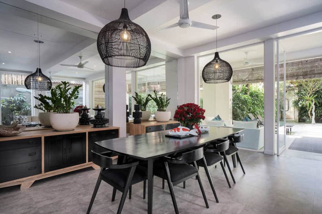 Large dining table great for group meals in light filled living space.
