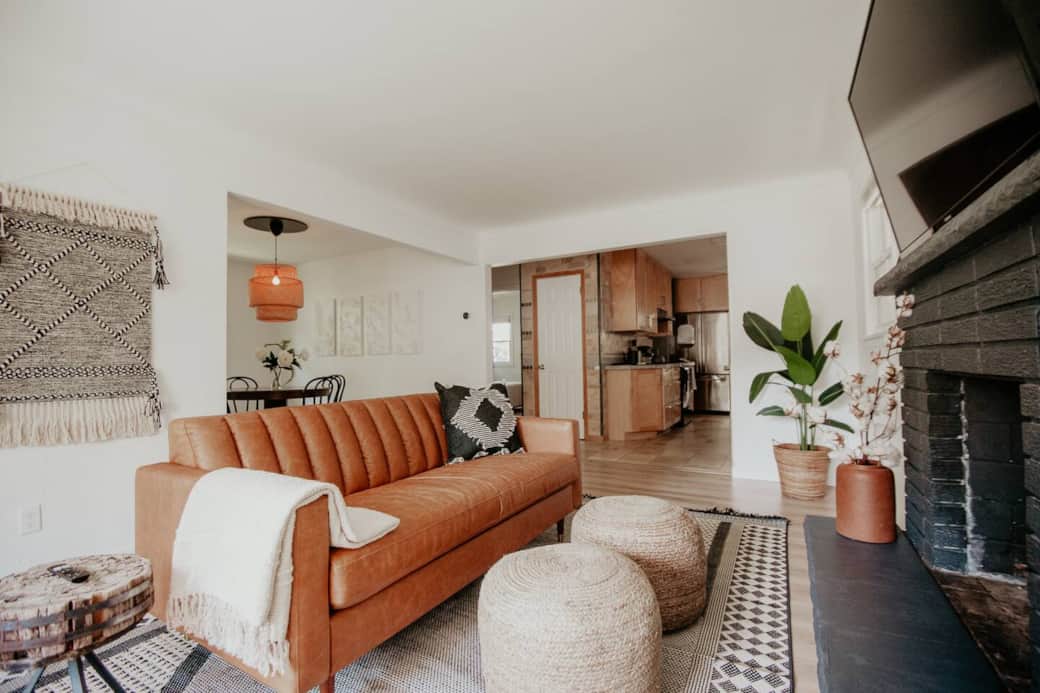 Living room with smart tv and leather couch