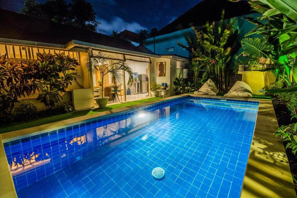 Pool surrounded by cute garden