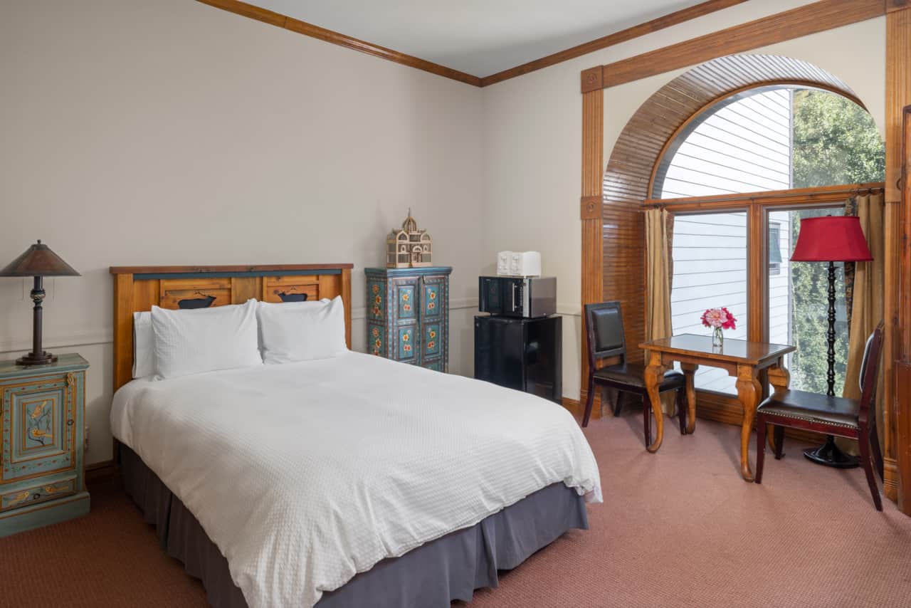 Comfortable queen bed at Village Hideaway