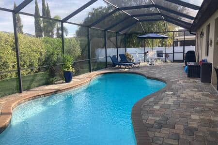 Rear pool area, chairs & table